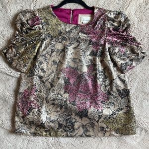 Sequined, puff sleeve dress shirt by Anthropologie.